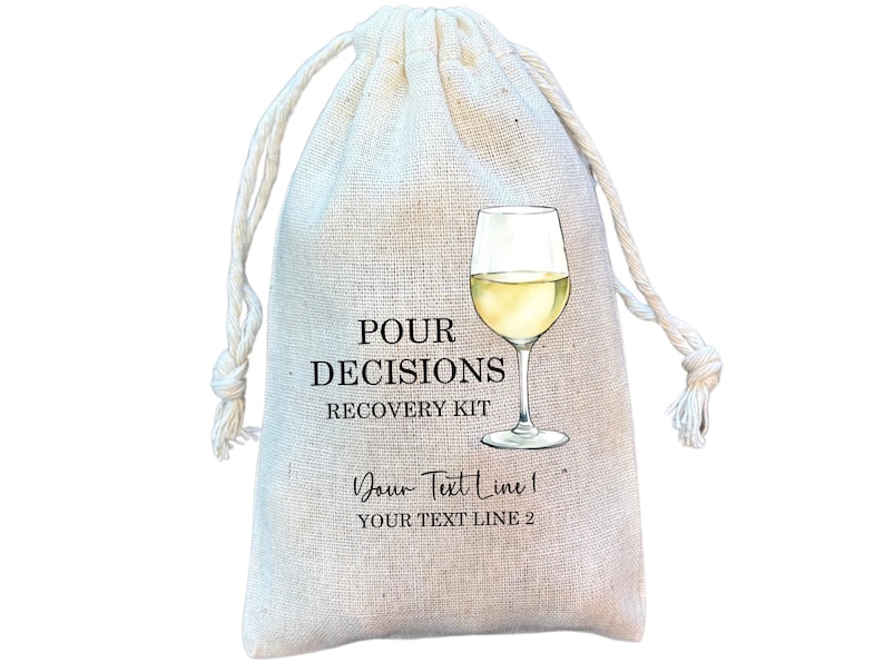 May include: A beige drawstring bag with the text "POUR DECISIONS RECOVERY KIT" and a wine glass illustration. The bag also includes space for custom text. The bag is made of a natural fabric.