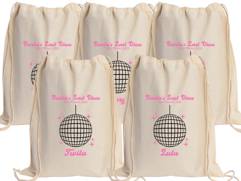 May include: Five white drawstring bags with a pink disco ball graphic and the text "Darla's Last Disco Scottsdale 2025". Two bags have the names "Twila" and "Zula" printed below the graphic.
