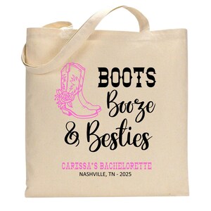 May include: A beige canvas tote bag featuring a pink graphic of a cowboy boot with a rose. The text reads BOOTS Booze & Besties in black and pink, followed by CARISSA'S BACHELORETTE and NASHVILLE, TN - 2025 in pink and black lettering.