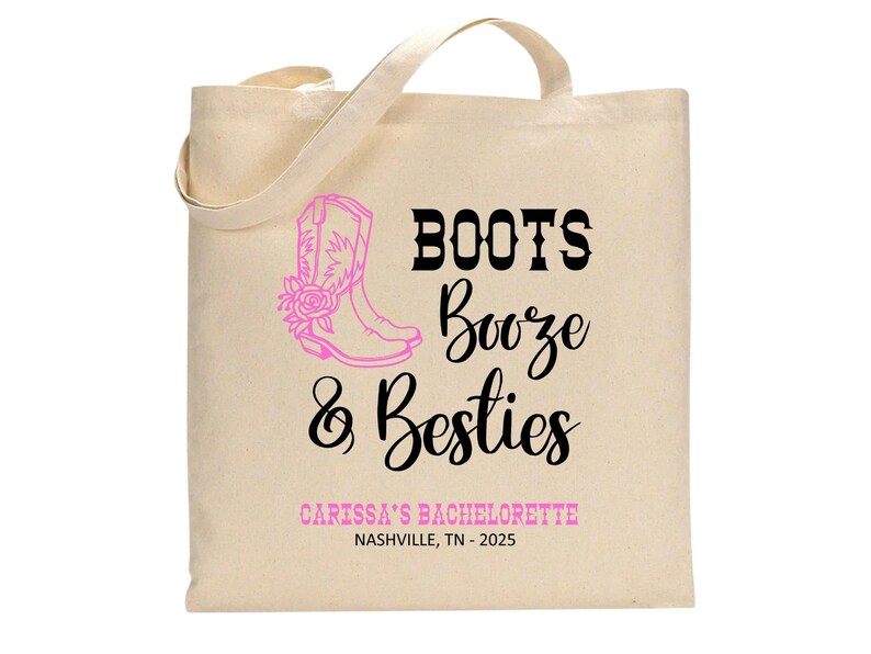 May include: A beige canvas tote bag featuring a pink graphic of a cowboy boot with a rose. The text reads BOOTS Booze & Besties in black and pink, followed by CARISSA'S BACHELORETTE and NASHVILLE, TN - 2025 in pink and black lettering.