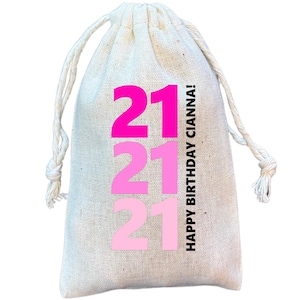 May include: A white drawstring bag with the text "21" in pink and "HAPPY BIRTHDAY CIANNA!" in black.