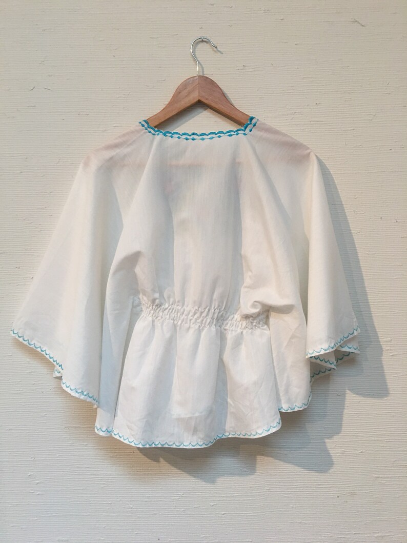 Blue floral embroidered butterly sleeve top