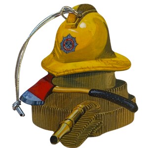 May include: A yellow firefighter helmet with a red and blue axe and a gold hose. The helmet has a badge with a crossed axe and the words "Fire Brigade" on it. The ornament is made of wood and has a silver string for hanging.