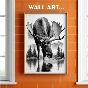 May include: Framed black and white wall art featuring a moose drinking from a lake, with mountains and trees in the background. The artwork is displayed on an orange tiled wall, with the text "WALL ART..." at the top.