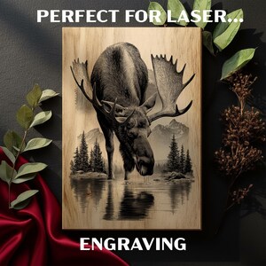 May include: Wooden wall art featuring a detailed illustration of a moose drinking from a lake, with mountains and pine trees in the background. The text "ENGRAVING" is at the bottom. The text "PERFECT FOR LASER..." is at the top.