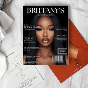 May include: A magazine cover featuring a black and white photograph of a woman with striking makeup. The magazine is titled "Brittany's 25th Birthday Bash" and includes the text "Runway Ready" and "Top 10 Reasons Why Brittany is the Best!"