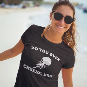 May include: A black t-shirt with a white graphic of a jellyfish and the text "Do you even cheese, bro?"