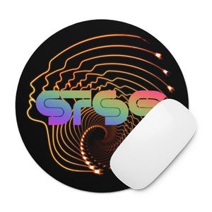 May include: A round black mousepad featuring a colorful gradient text reading STSG centered over a glowing orange line art graphic of a human head profile with electrical plug ends trailing into a spiral vortex pattern, with a white computer mouse.