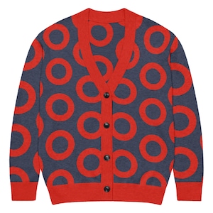 May include: A navy blue cardigan with a repeating pattern of large red circles. The sweater has a V-neck, red trim, and black buttons. The long-sleeved sweater is a comfortable knit.