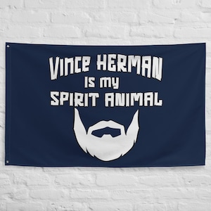Puede incluir: Una bandera azul marino con texto blanco que dice "Vince Herman is my spirit animal" y una silueta blanca de una barba.