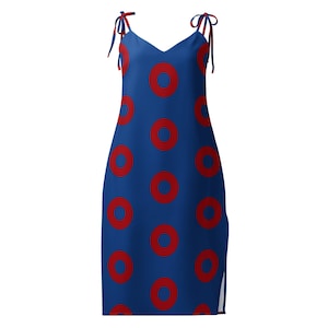 May include: A knee-length blue dress featuring a repeating pattern of solid red circles. The garment has a V-neckline and thin shoulder straps that tie into bows at the top. A small vertical slit is visible along the lower right side hem.