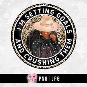 May include: A black and gold circular design with the text "I'm Setting Goals And Crushing Them" in white. A woman with brown skin is wearing a black and white polka dot shirt and a wide-brimmed hat with a leopard print background.