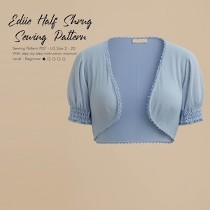 May include: A light blue half shrug sewing pattern. The pattern includes instructions for sizes US 2-20. The shrug has short, puffed sleeves and a scalloped edge. The text on the image reads "Ediüe Half Shrug Sewing Pattern".