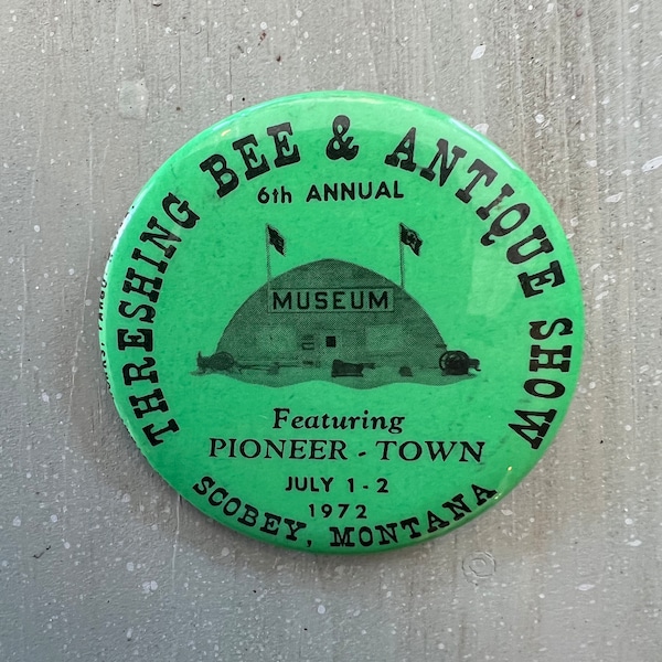 1972 Scobey Montana Threshing Bee & Antique Show 6th annual button badge featuring Pioneer Town by Fargo Rubber Stamp Works