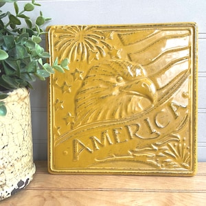 Vintage Ceramic AMERICA Eagle Trivet Tile Plaque, Gold Patriotic Decor, Flag Fireworks Bald Eagle Head by Great Gatherings
