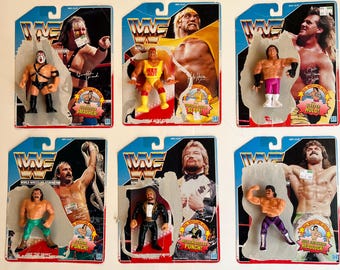 May include: A set of ten vintage WWF action figures in their original packaging. The figures include Hulk Hogan, Jake "The Snake" Roberts, The Ultimate Warrior, and more. Each figure is posed in a wrestling move and comes with a signature move.