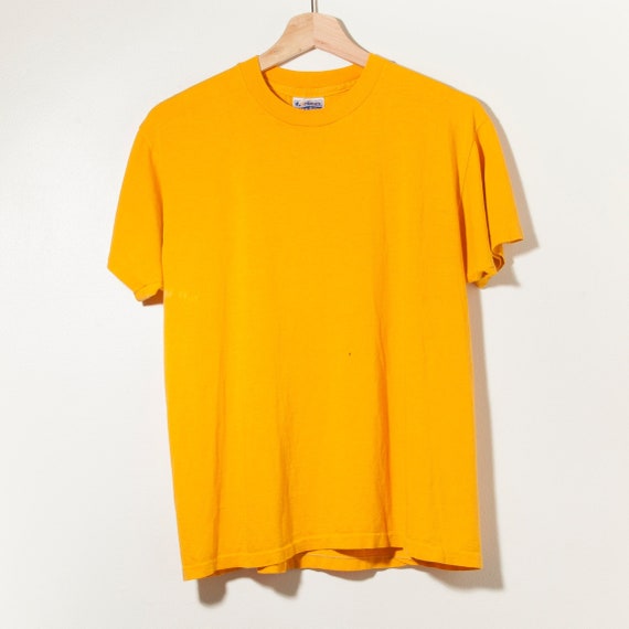 mustard yellow nike shirt