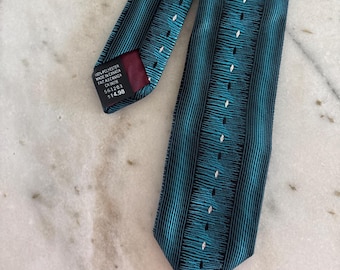 Corbata estilo western vintage, delgada y estrecha, de color tirquoise, plateada y negra, hecha en Canadá.