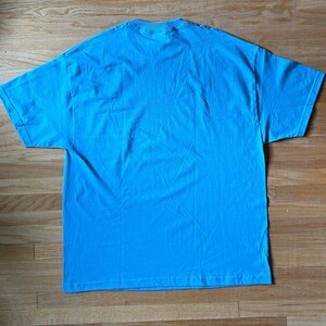 May include: A plain, light blue t-shirt. The shirt is made of a soft, comfortable material.