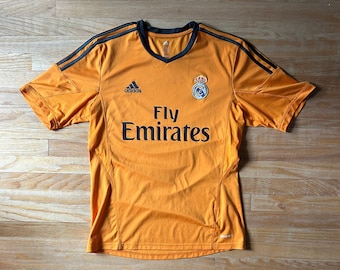 Camiseta de fútbol naranja del Real Madrid Adidas, talla M.