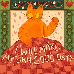 May include: An orange cat with yellow eyes is sewing a red and white patchwork quilt. The quilt has the words "I will make my own good days" stitched into it.