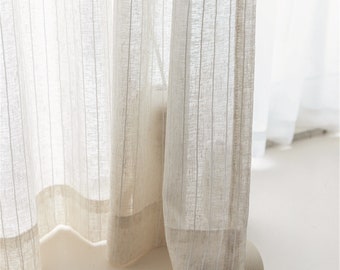 May include: White sheer curtains with a subtle striped pattern and a solid white bottom border.