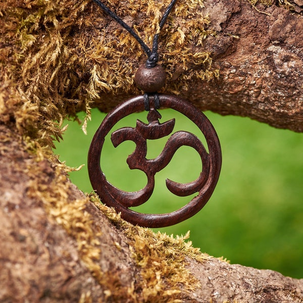 Wooden OM pendant made from recycled Rosewood and hung on a adjustable waxed Cotton thong