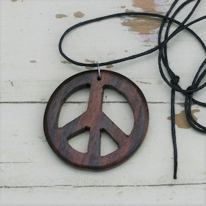 Wooden Peace Symbol Made from Reclaimed Rosewood and hung on a adjustable waxed Cotton Cord.