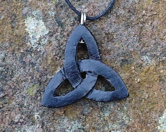 Wooden Bog Oak Celtic Trinity knot pendant hung on a adjustable waxed Cotton thong.