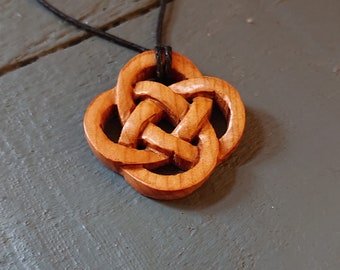 Small handmade Celtic Knot pendant made from Windfallen Irish Yew,hung on a adjustable waxed cotton thong.
