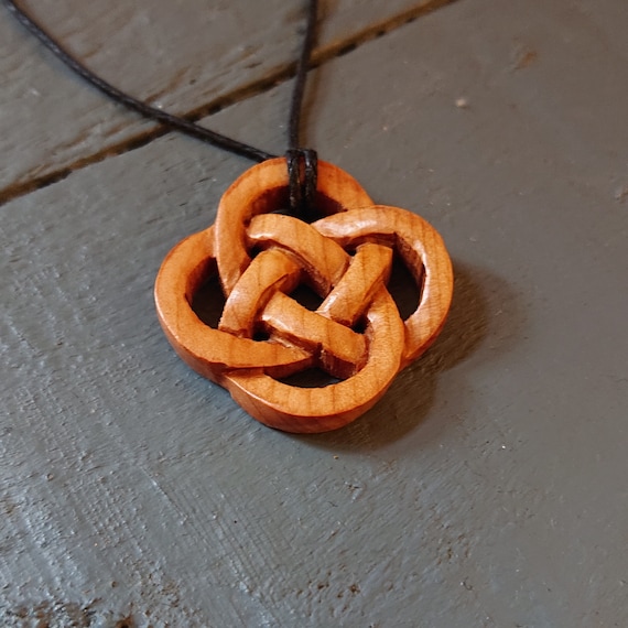 Small handmade Celtic Knot pendant made from Windfallen Irish Yew,hung on a adjustable waxed cotton thong.