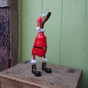 Cute individually painted Santa Duck Measuring 40cm from the Tip of his beak to the Sole of his Feet made from Bamboo root.