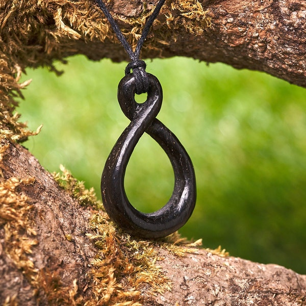 Wooden Bog Oak Celtic knot pendant hung on a adjustable waxed Cotton thong