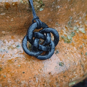 Wooden Bog Oak Celtic knot pendant hung on a adjustable waxed Cotton thong