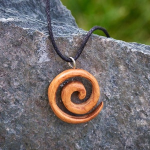 Small Wooden Spiral pendant handmade from Windfallen Irish Yew hung on a adjustable Waxed Cotton Thong