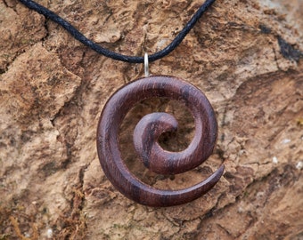 Small Wooden Spiral Pendant made from reclaimed Rosewood and hung on a Waxed Cotton Thong.