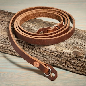 Hand made chestnut leather camera strap with copper rivets. image 1