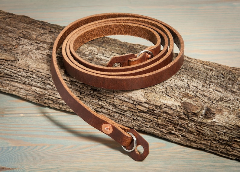 Hand made chestnut leather camera strap with copper rivets. image 1