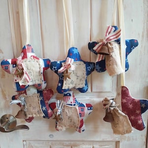 Americana Patriotic fabric star duos with stamped tea dyed tags rusted bells and/0r rusted stars