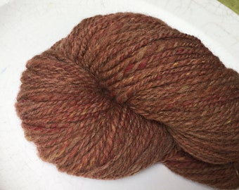 Hand spun Yarn, Manx Loaghton & Merino, brown with Autumn flecks of red and yellow.