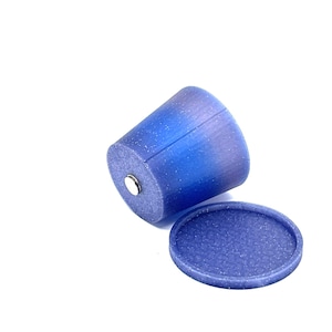 May include: A blue and purple speckled ceramic planter with a matching saucer. The planter has a rounded shape and a smooth, textured finish.