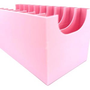 May include: A pink plastic organizer with multiple compartments for storing small items.