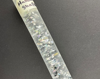 May include: A clear glass rolling pin with a label that says "Halloween Shakers" and black and silver glitter inside.