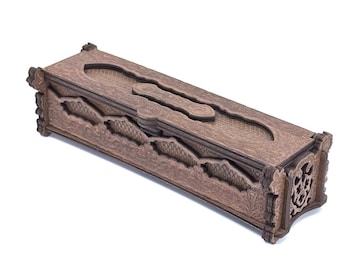 May include: A decorative wooden box with a detailed, carved design. The box is rectangular with a lid and features intricate patterns and cutouts. The wood has a warm, brown tone, and the box appears to be handcrafted.