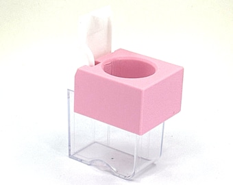 May include: A pink plastic container with a clear plastic base and a white lid. The lid is open and the container is empty.