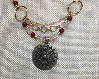 Brass pendant with citrine and carnelian