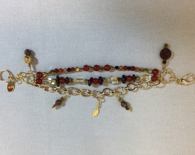 Triple strand charm bracelet with carnelian, garnet, hematite and citrine