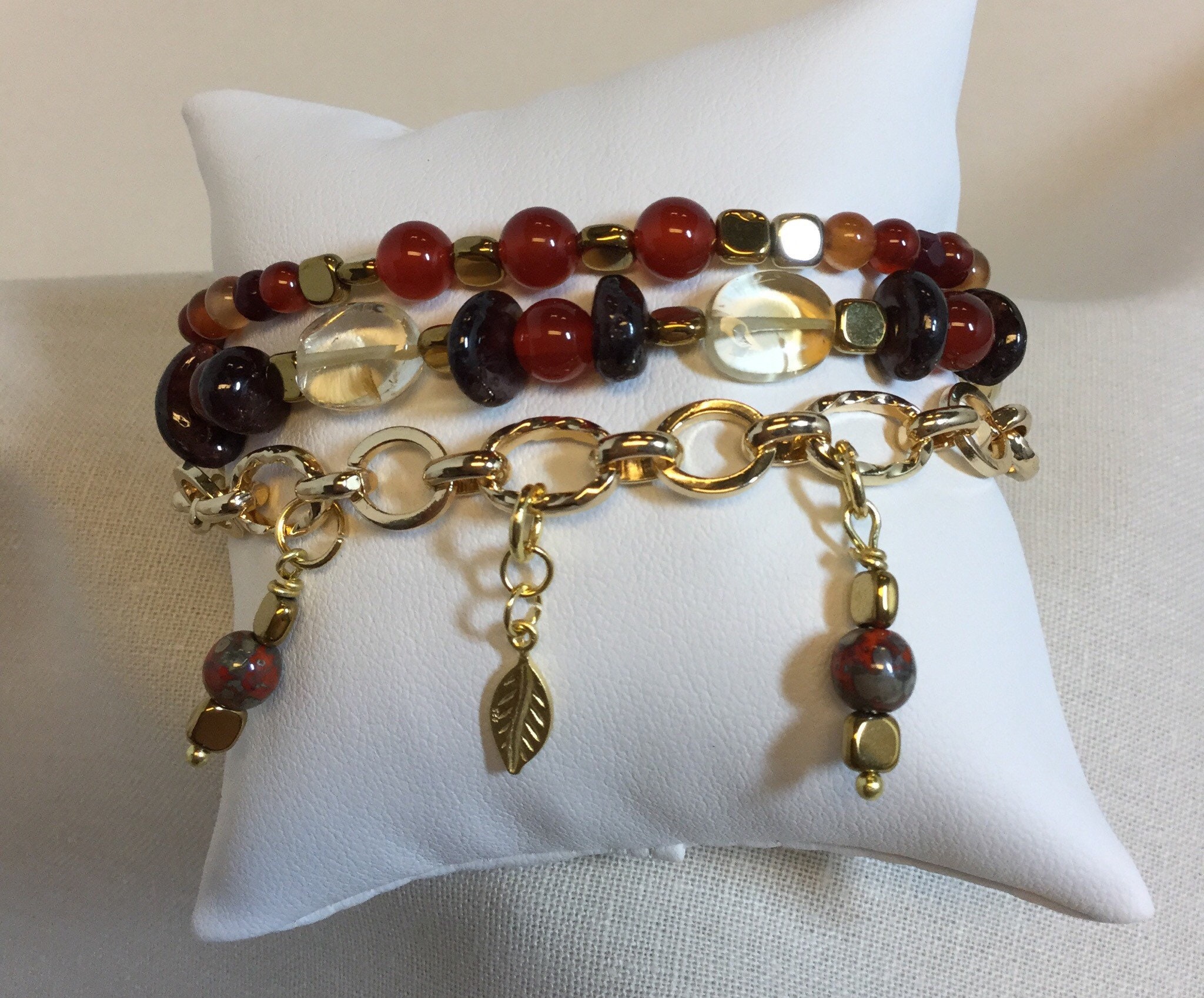 Triple strand charm bracelet with carnelian, hematite and citrine