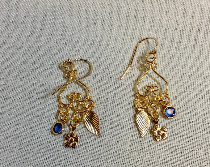 Gold chandelier earrings with leaf and blue drop charms