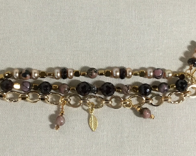 Triple strand charm bracelet with garnet, pink jasper, pearls, and hematite